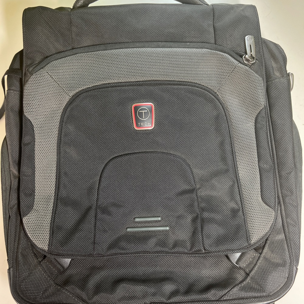 TUMI TEC Backpack with lots of pockets in excellent condition.Has shoulder strap